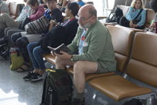 Mark sits in the Hanoi airport