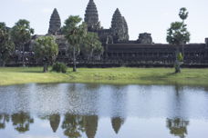view of Angkor Wat from across a shallow pond