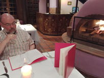 at the restaurant, Mark studies the menu