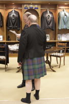 MTK in kilt only, from the rear