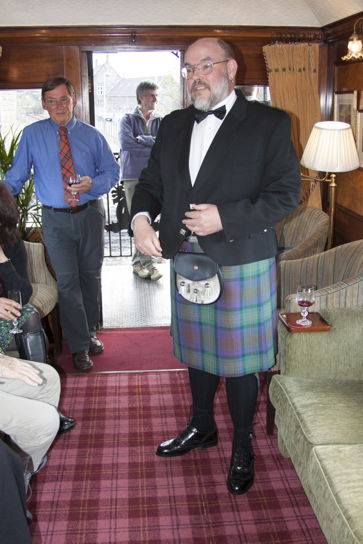 Mark in the observation car of the Royal Scotsman, wearing a kilt