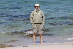 Mark wades in the waters of Wineglass Bay